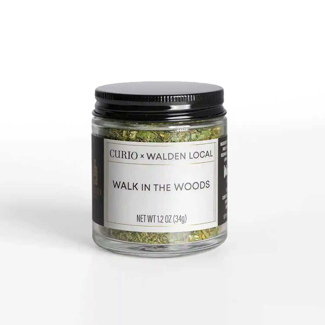 A glass jar of Walk In The Woods, a collaboration spice blend with Walden Local and Curio Spice