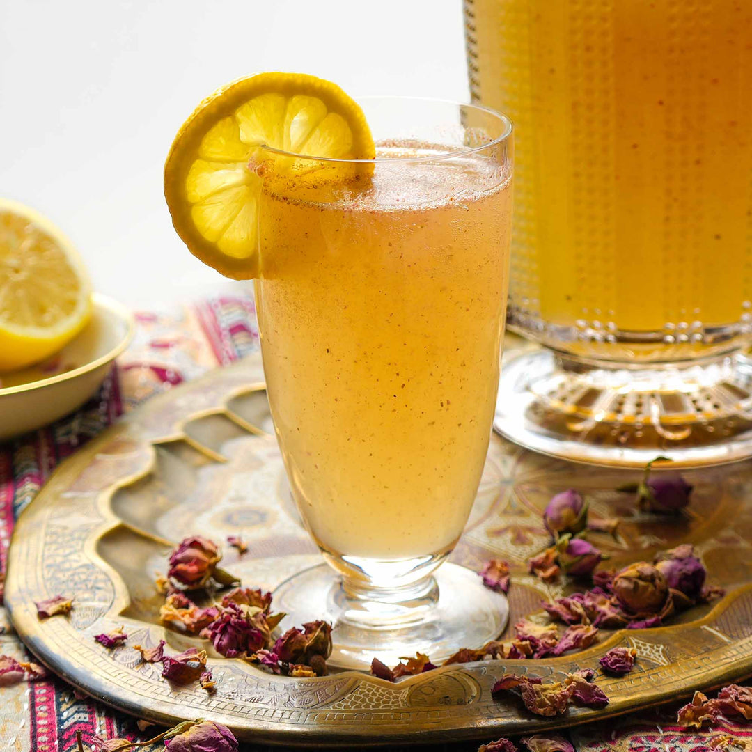 Rose Lemonade sitting on a table with flower buds