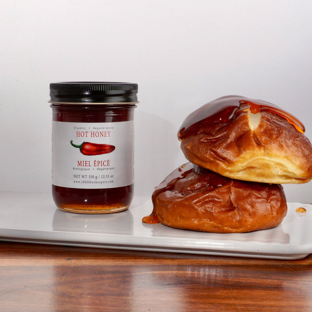 African Bronze Hot Honey poured over pretzel buns