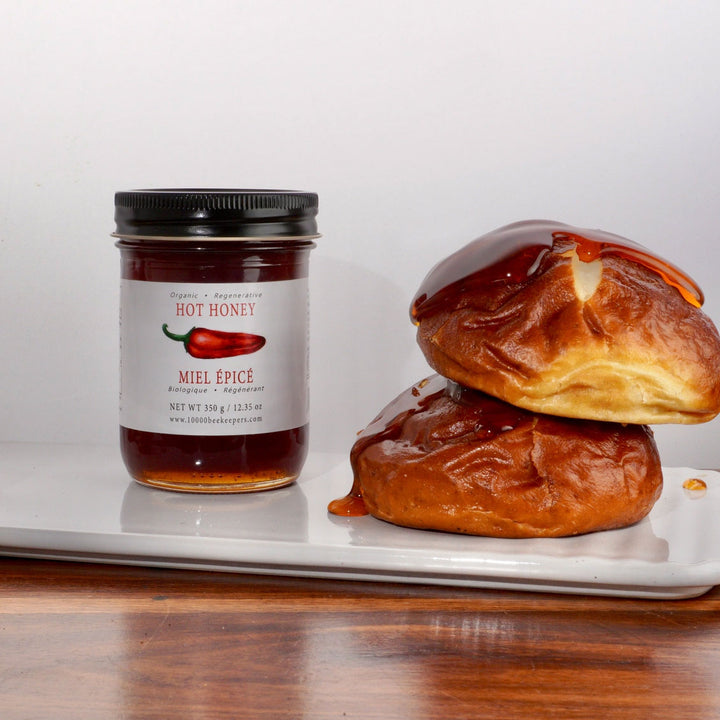 African Bronze Hot Honey poured over pretzel buns