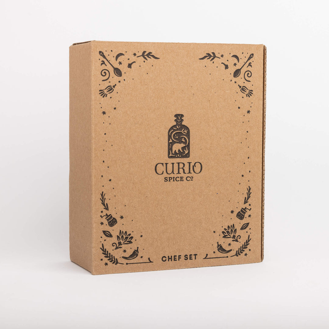 Kraft paper box with 'Curio Spice Co' branding on a white background