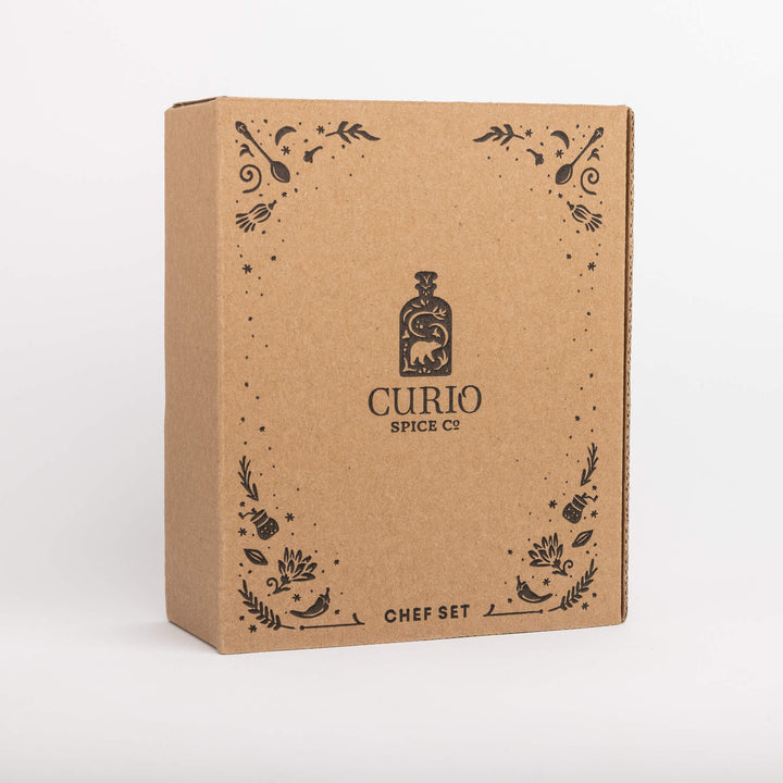 Kraft paper box with 'Curio Spice Co' branding on a white background