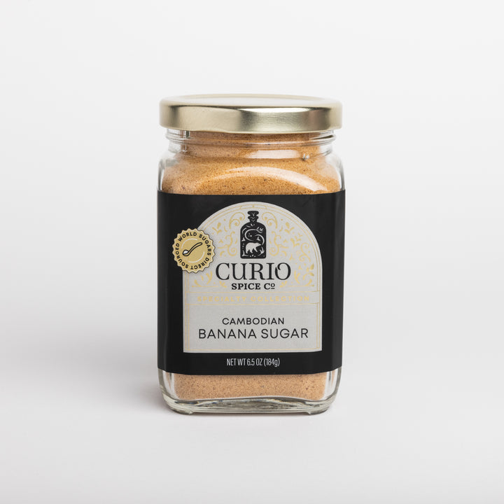 Jar of Cambodian Banana Sugar from Curio Spice Co. on a light gray background