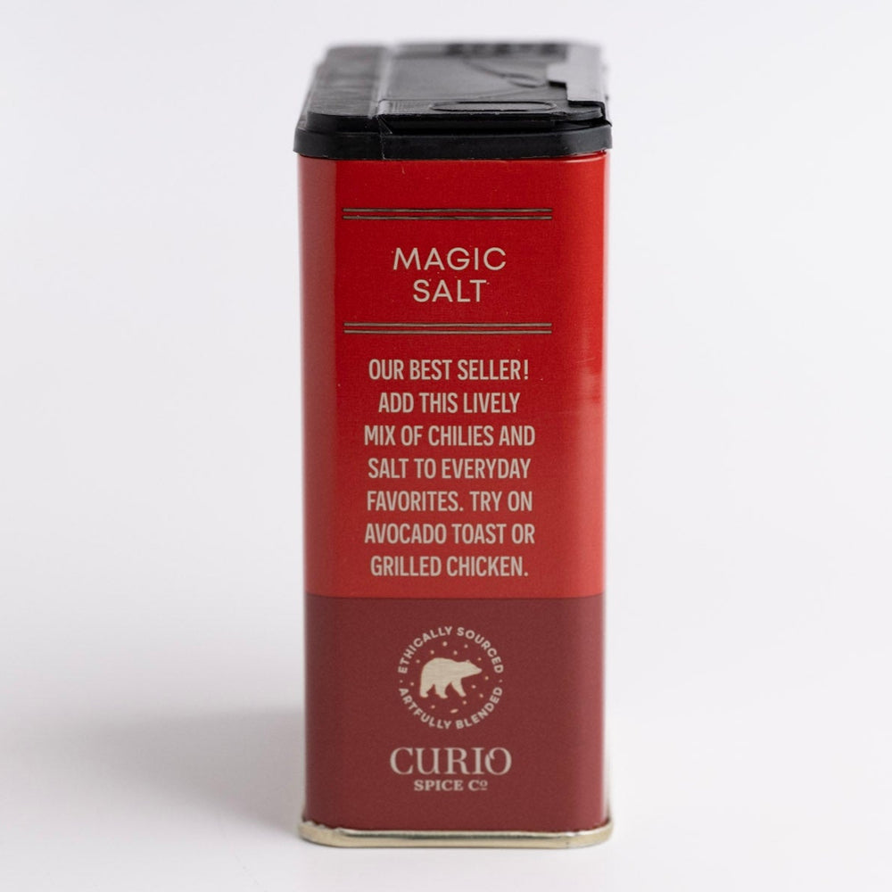 Red container of 'Magic Salt' by Curio Spice Co. on a light gray background