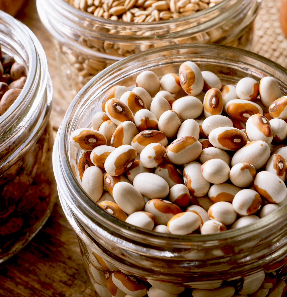 Dried yellow-eyed beans in a jar.