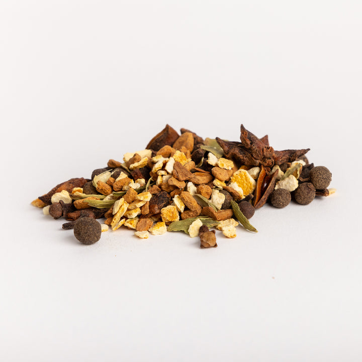 Pile of mulling spice mix on white background