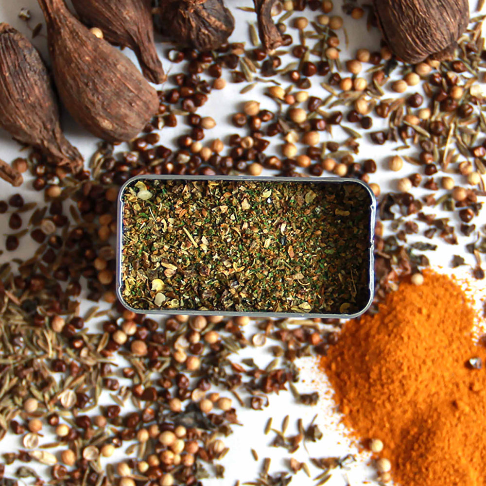 Top-down view of Bonga Spice with chilies, coriander, cumin, and more.