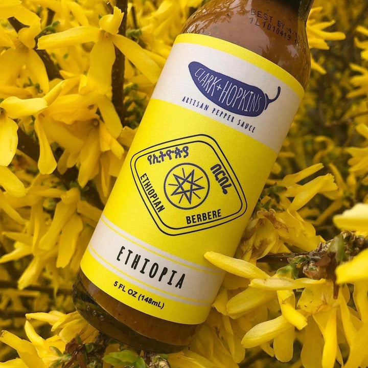 Clark + Hopkins Ethiopia label next to yellow flowers
