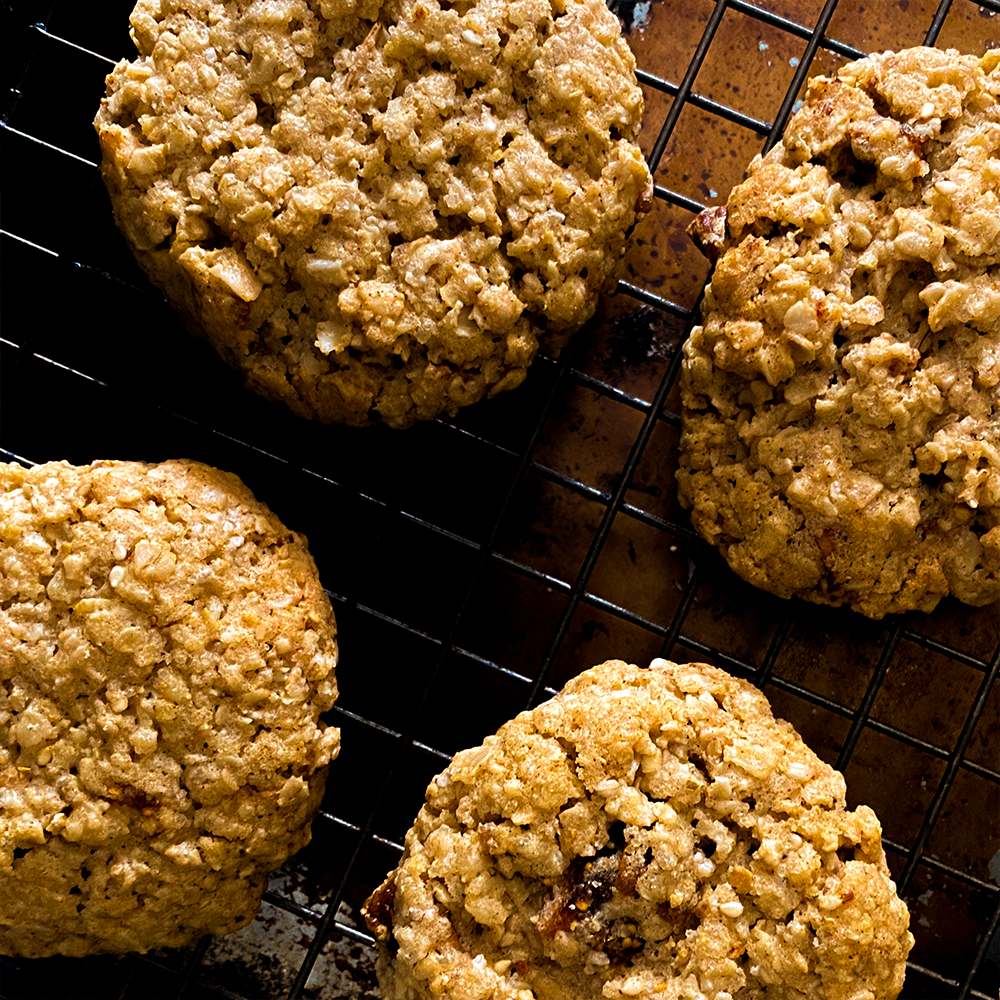 Oatmeal cookies on a cooling rack.