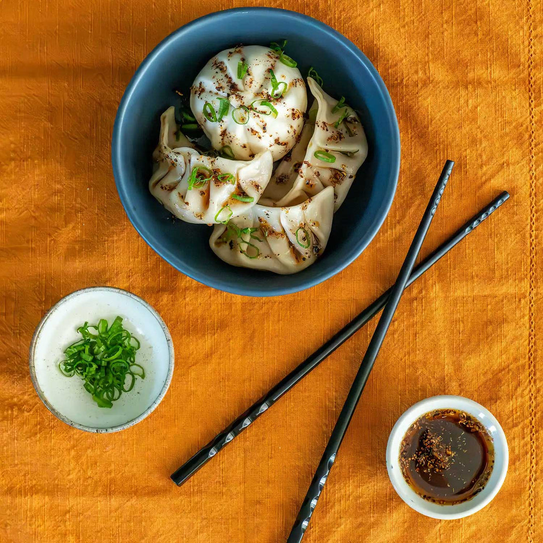 Betty Liu's Chile Crisp Dust as an oil drizzled on dumplings and bao buns.