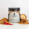 A glass jar of Betty Liu's Chile Crisp Dust, a collaboration spice blend with Betty Liu and Curio Spice.