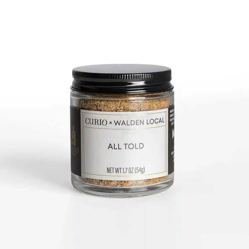 A glass jar of All Told, a collaboration spice blend with Walden Local and Curio Spice