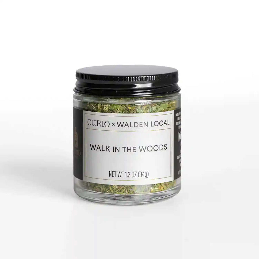 A glass jar of Walk In The Woods, a collaboration spice blend with Walden Local and Curio Spice