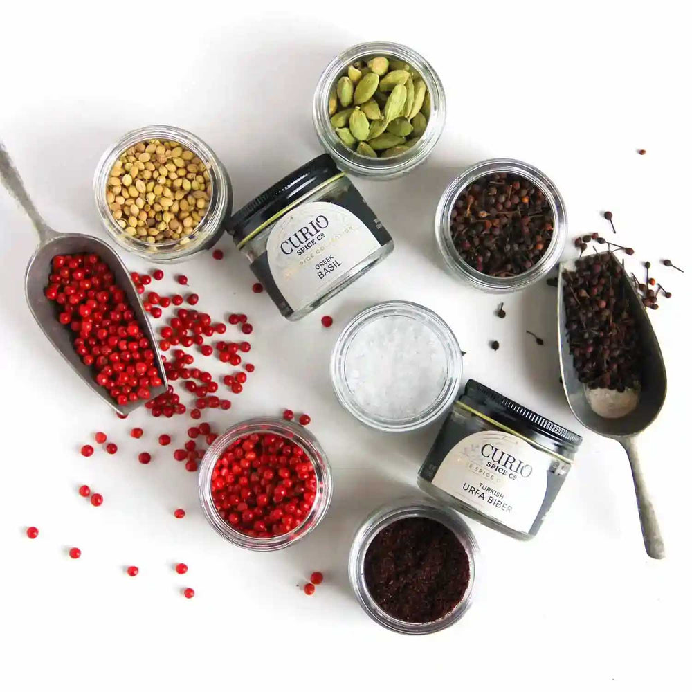 Elevated Essentials scattering of spices with a top-down view of spices in the set