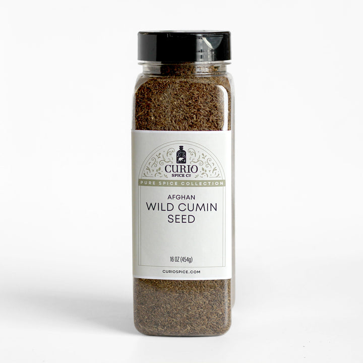 Curio Spice Co. fair-trade single origin sustainable Afghan wild cumin seed in a bulk jar.