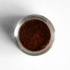 Top-down view of black garlic powder