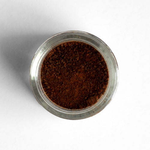 Top-down view of black garlic powder