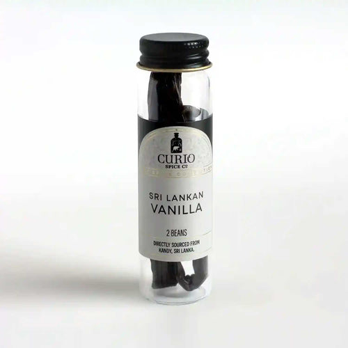 Slim glass jar of Sri Lankan Vanilla beans.