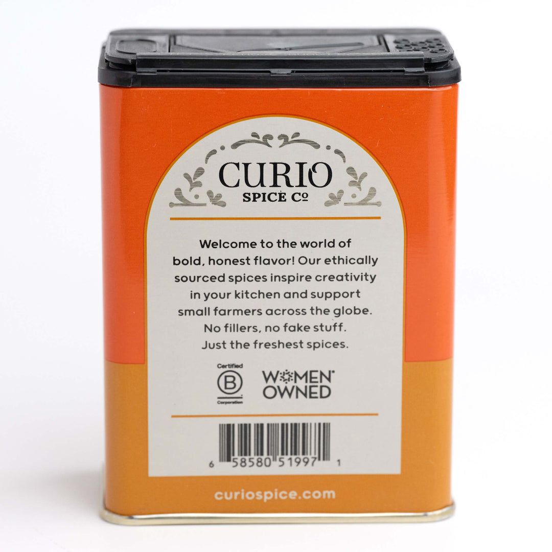 Curio Spice Co. spice container with a white label on an orange background