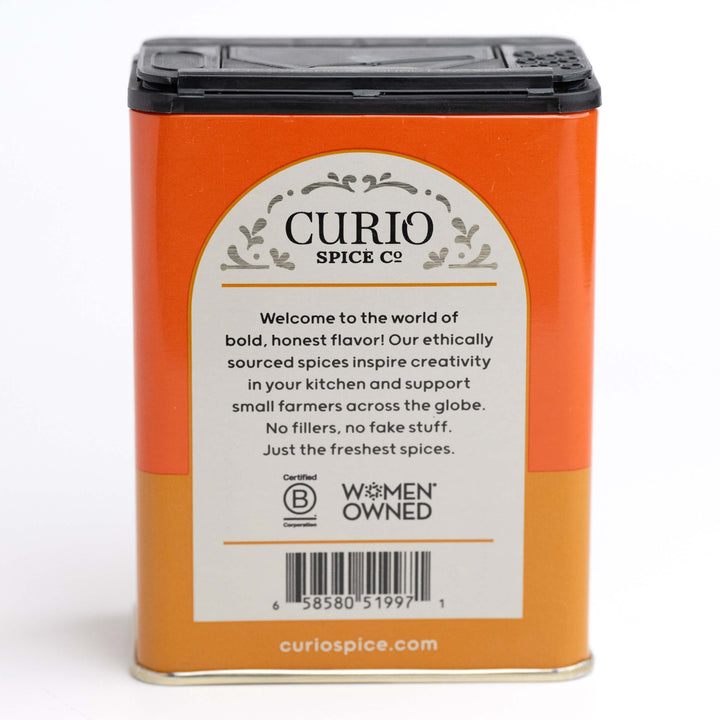 Curio Spice Co. spice container with a white label on an orange background