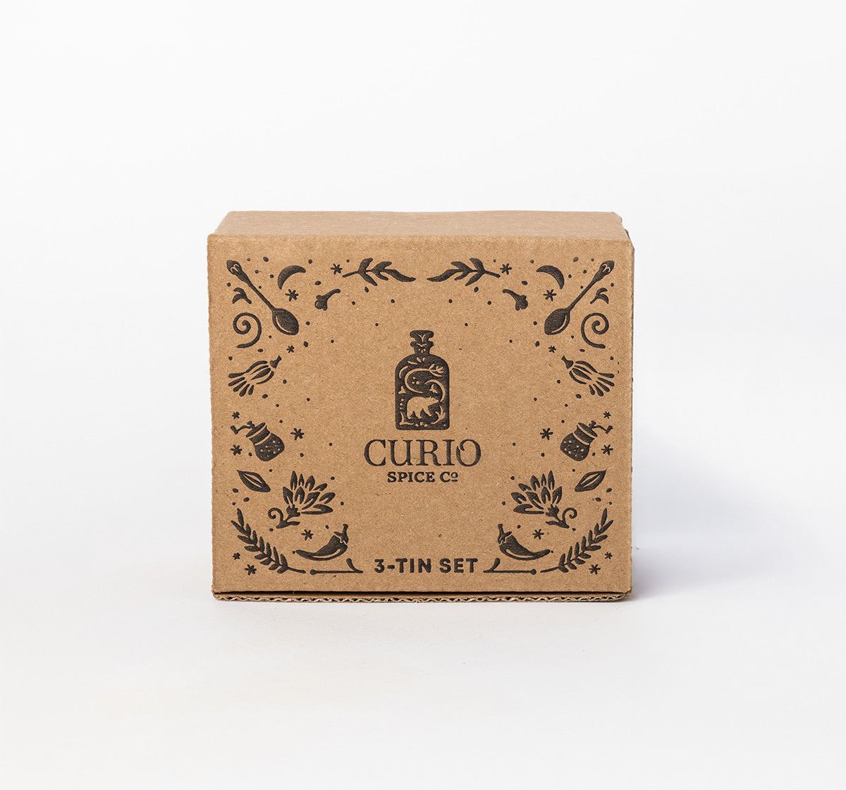 Brown cardboard box with 'Curio Spice Co' branding on a white background