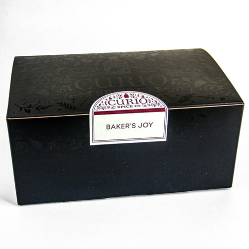 Curio Spice Co. Baker's joy baking gift set featuring Signature Blends, fair-trade single origin sustainable spices, and a Microplane rasp grater in a sealed box.