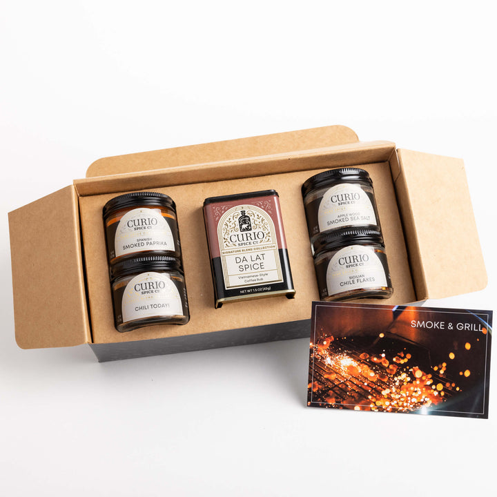Curio Spice Co. Smoke And Grill gift set featuring the Da Lat Spice Signature Blend, Chili Today! Classic Blend, and and fair-trade single origin sustainable spices.