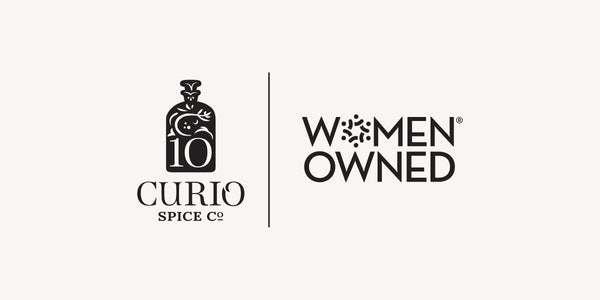 Curio Spice Co. logo with 'Women Owned' certification badge on a white background