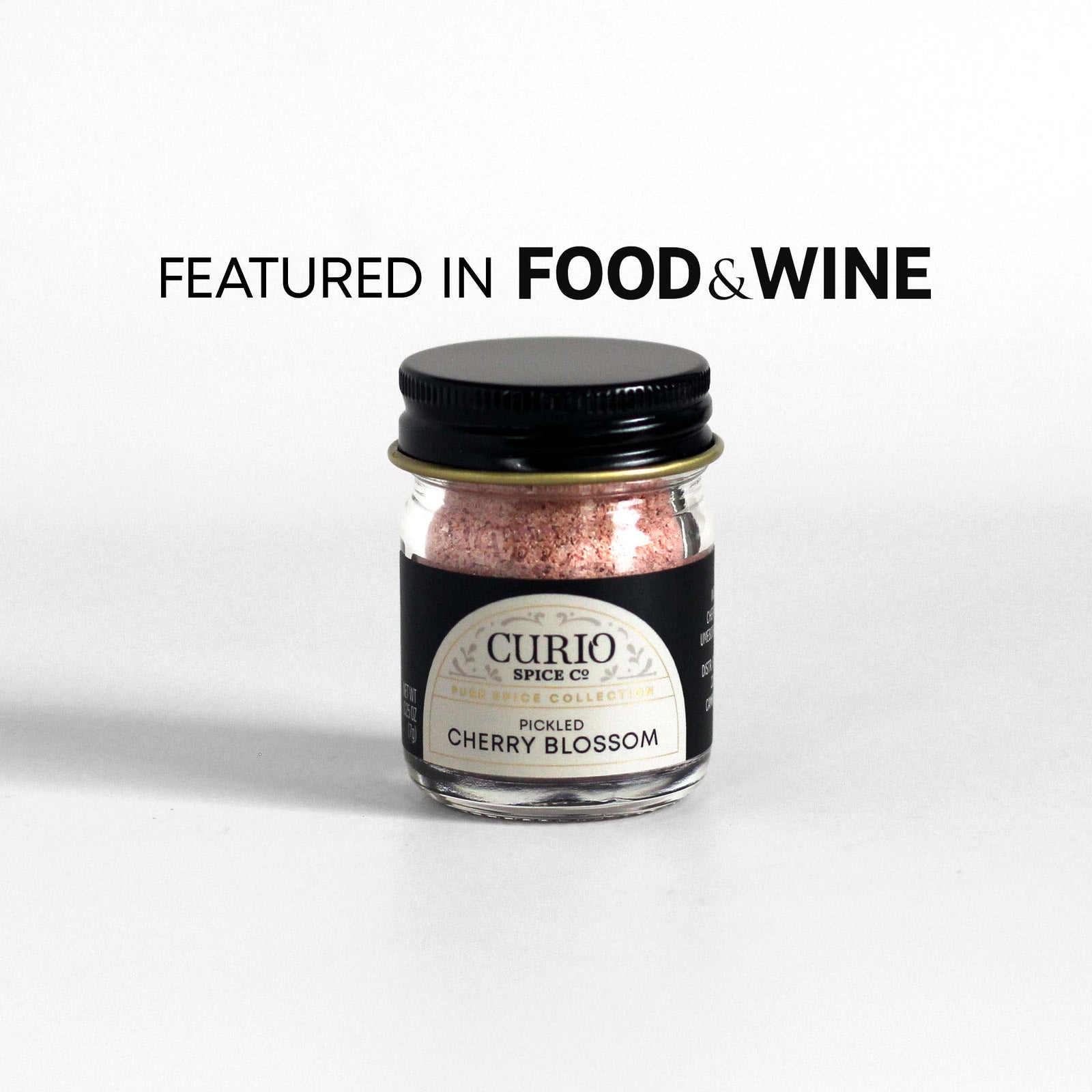 Curio Spice Co. fair-trade single origin sustainable Pickled Cherry Blossom in a glass jar, as featured in Food & Wine.