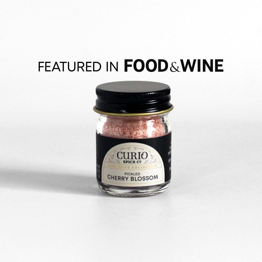 Curio Spice Co. fair-trade single origin sustainable Pickled Cherry Blossom in a glass jar, as featured in Food & Wine.