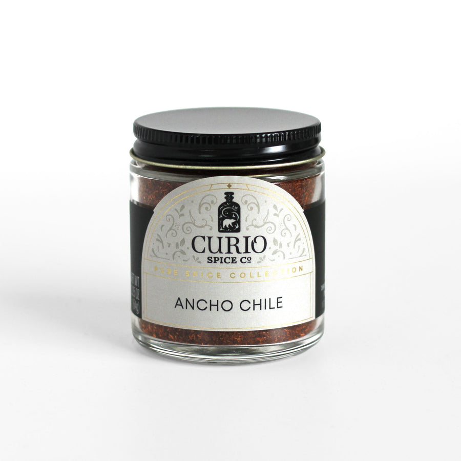 Curio Spice Co. fair-trade single origin sustainable California ground ancho chile in a glass jar.