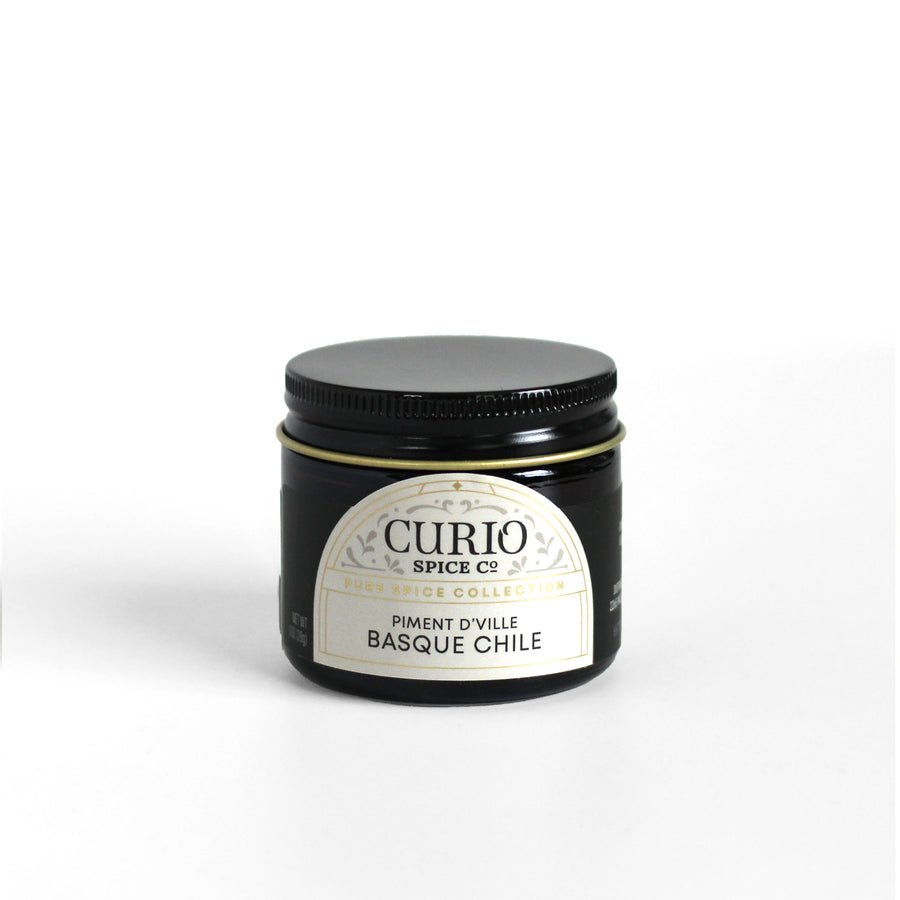 Curio Spice Co. fair-trade single origin sustainable Piment d'Ville Basque Chile in a glass jar.
