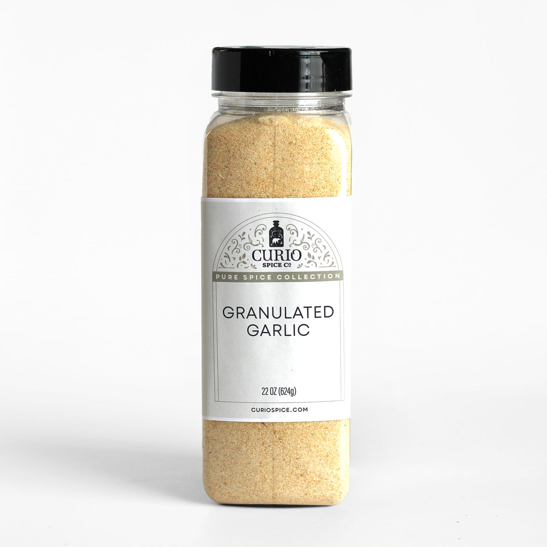 Bulk 22 oz. jar of granulated garlic.