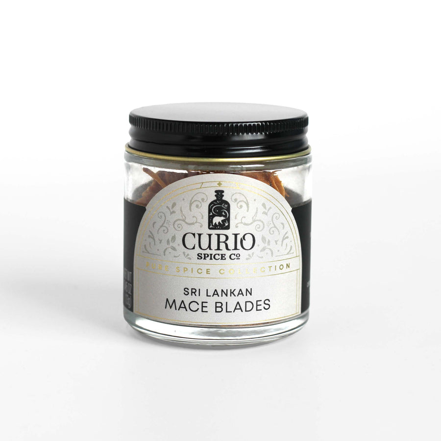 Curio Spice Co. fair-trade single origin sustainable Sri Lankan mace blades in a glass jar.