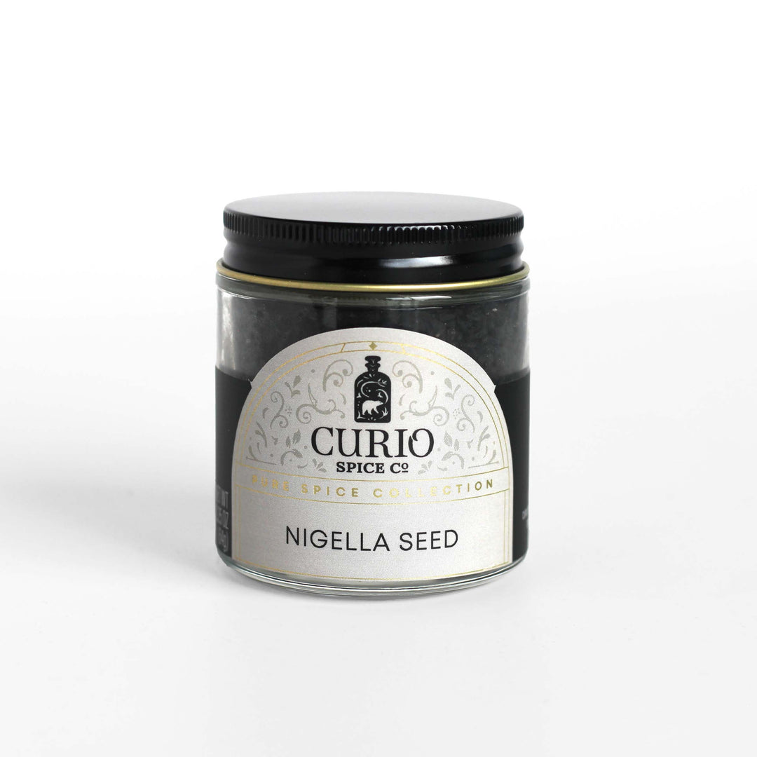 Curio Spice Co. fair-trade single origin sustainable nigella seed in a glass jar.