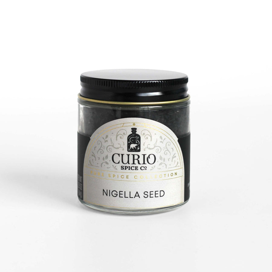 Curio Spice Co. fair-trade single origin sustainable nigella seed in a glass jar.