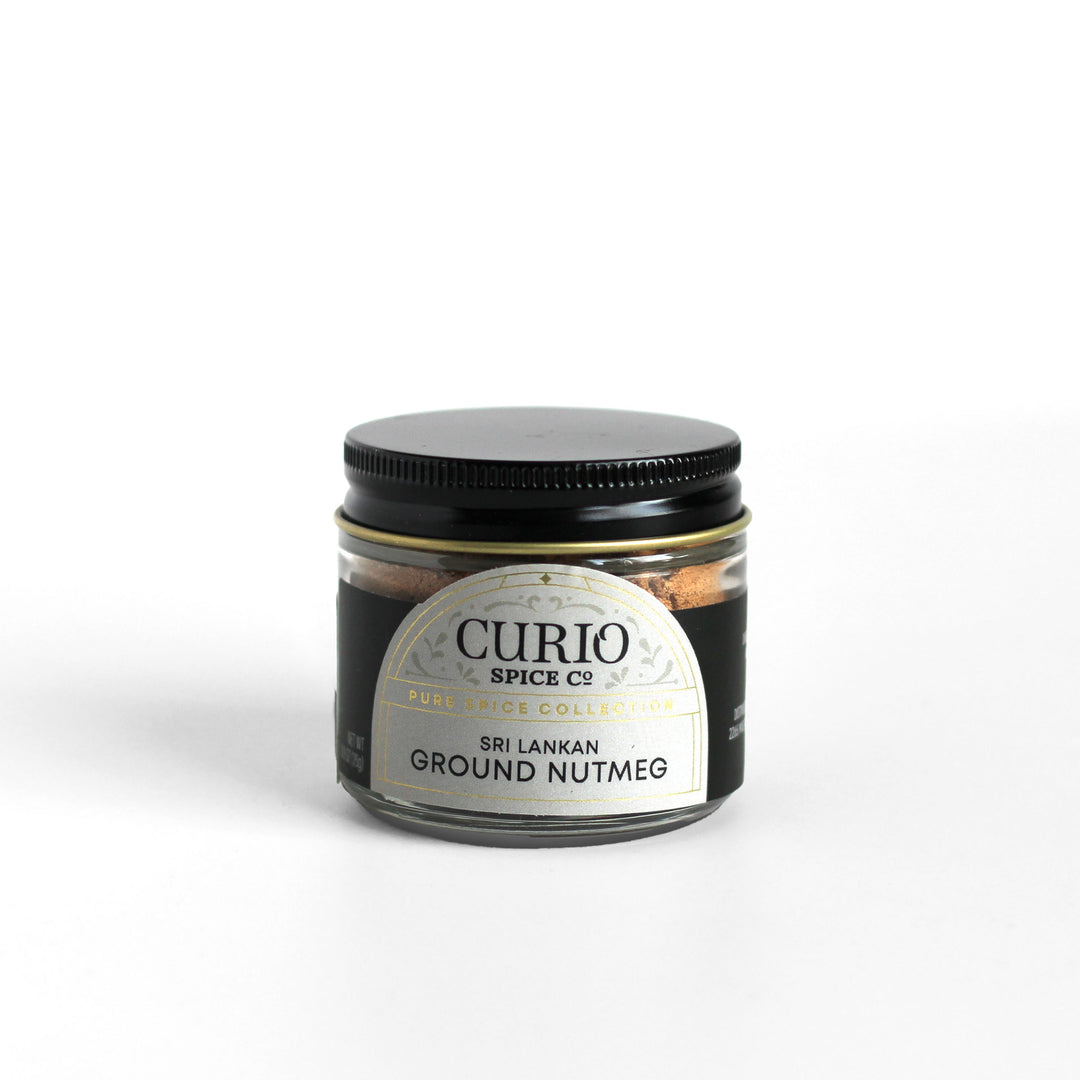 Curio Spice Co. fair-trade single origin sustainable Sri Lankan ground nutmeg in a glass jar.