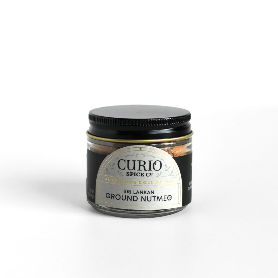 Curio Spice Co. fair-trade single origin sustainable Sri Lankan ground nutmeg in a glass jar.