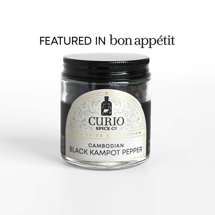 Curio Spice Co. fair-trade single origin sustainable Cambodian Black Kampot Pepper in a glass jar, as featured in Bon Appetit.