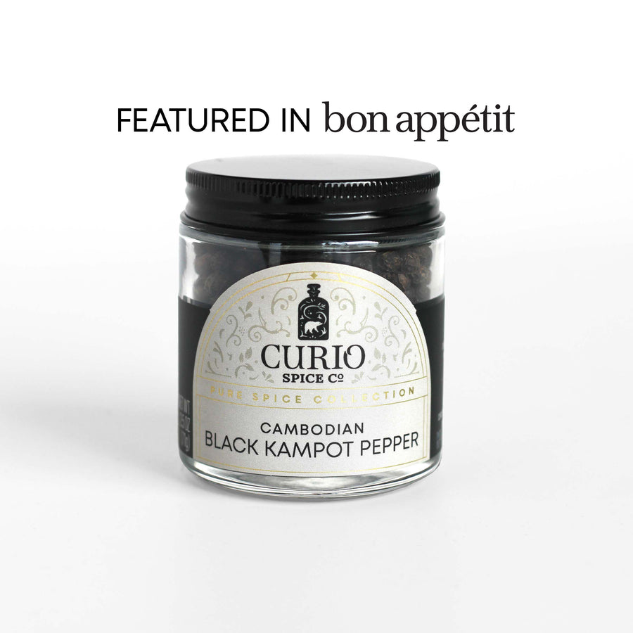 Curio Spice Co. fair-trade single origin sustainable Cambodian Black Kampot Pepper in a glass jar, as featured in Bon Appetit.