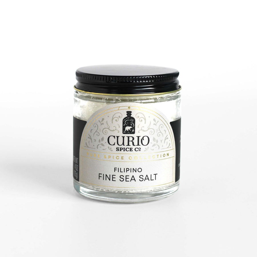 Curio Spice Co. fair-trade single origin sustainable Filipino Fine Sea Salt Fino Asin in a glass jar.
