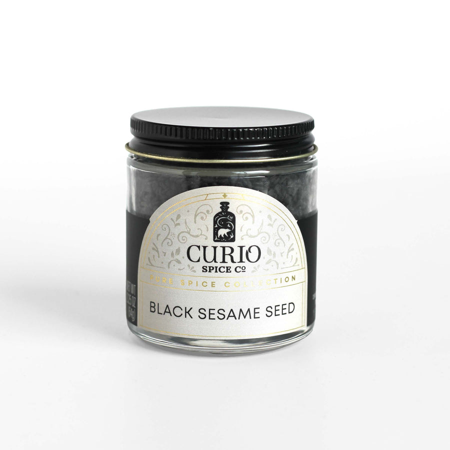 Curio Spice Co. fair-trade single origin sustainable black sesame seeds in a glass jar.