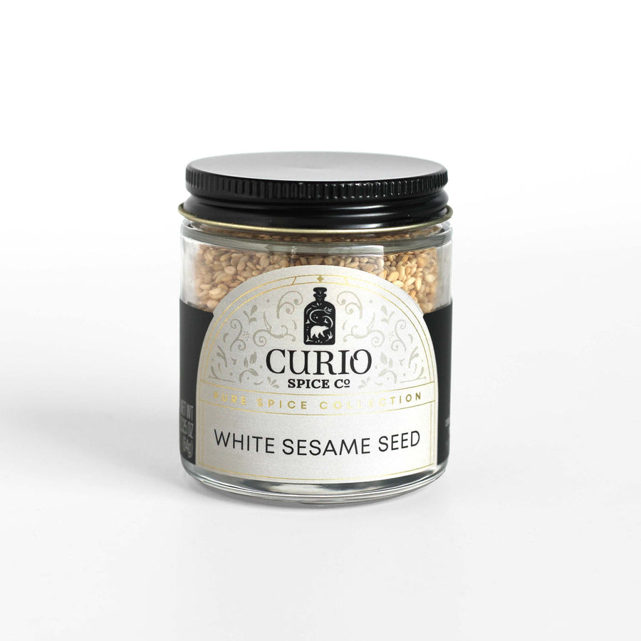 Curio Spice Co. fair-trade single origin sustainable white sesame seed in a glass jar.