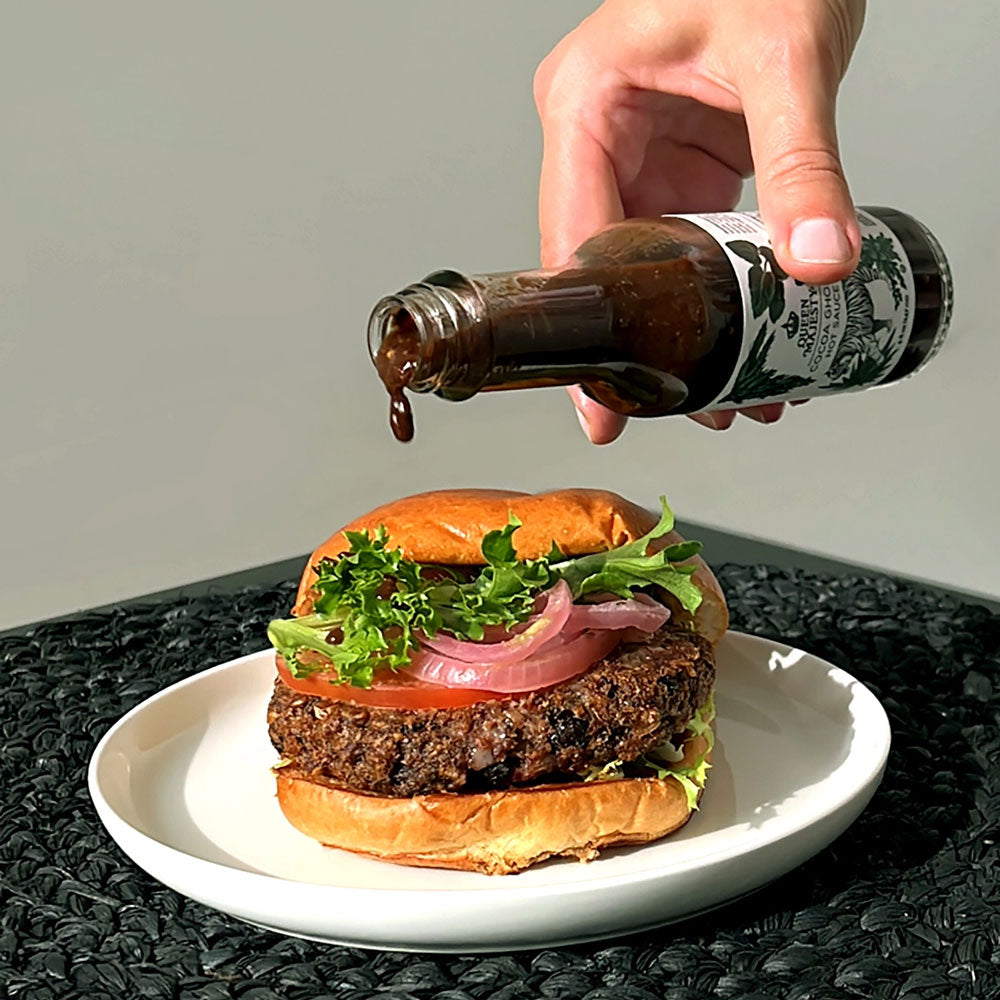 Cocoa Ghost Hot Sauce on a burger