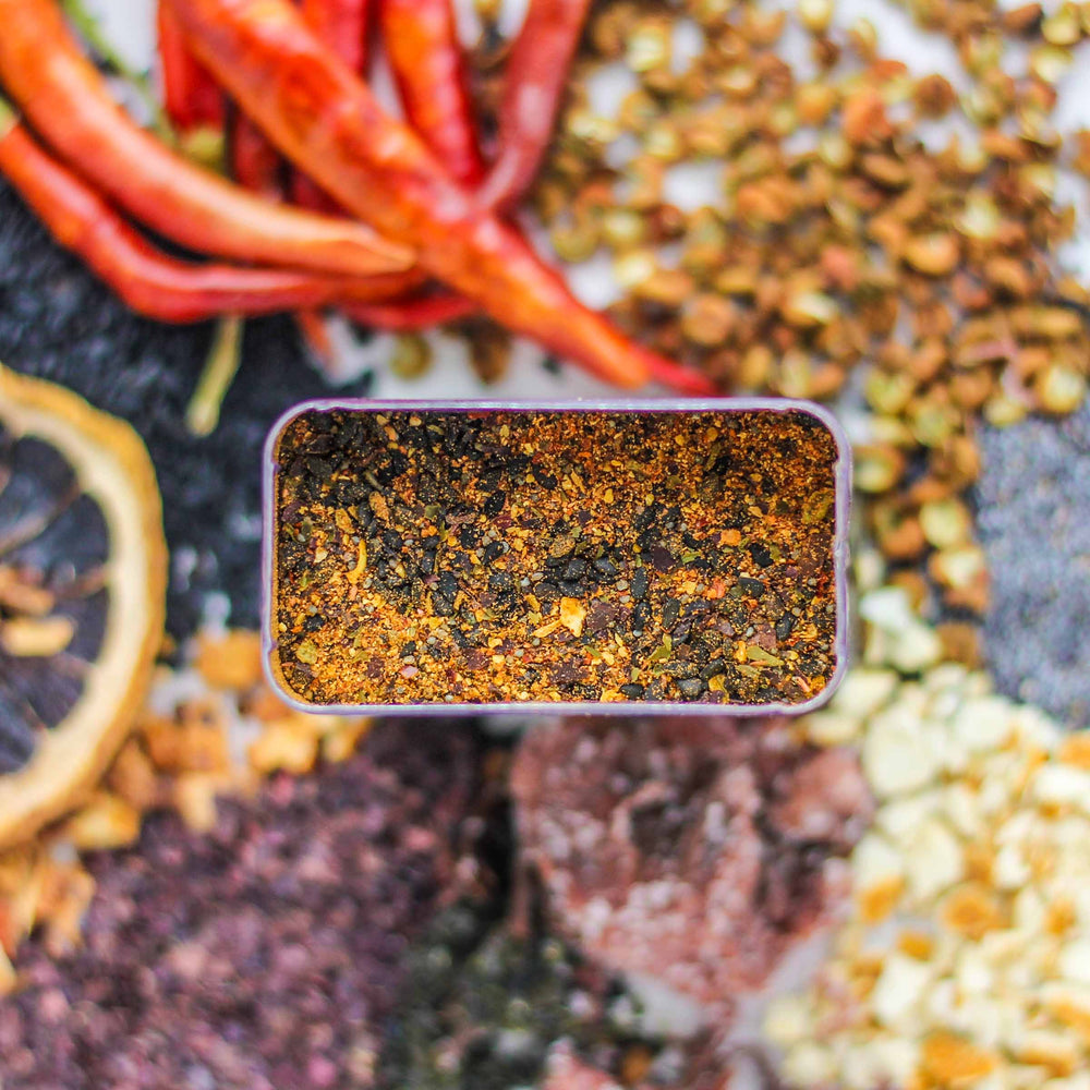 Top-down view of Edo Spice with black sesame, orange peel, Japones chilies, and more.