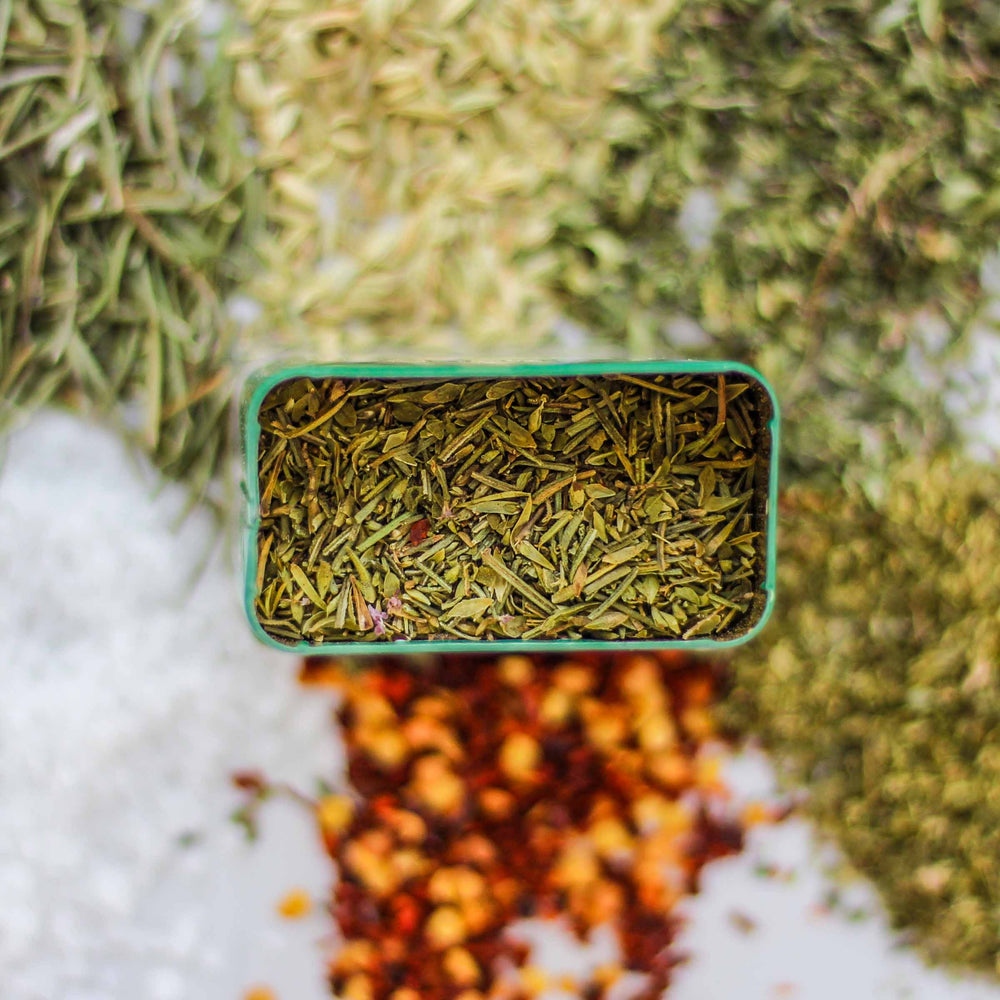 Top-down of Ferla Spice with rosemary, wild fennel, Trapini sea salt, and more.