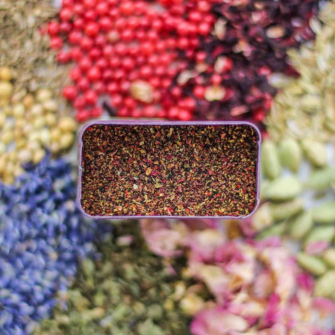 Top-down view of Fleur Spice featuring hibiscus, pink pepper, anise, and more.