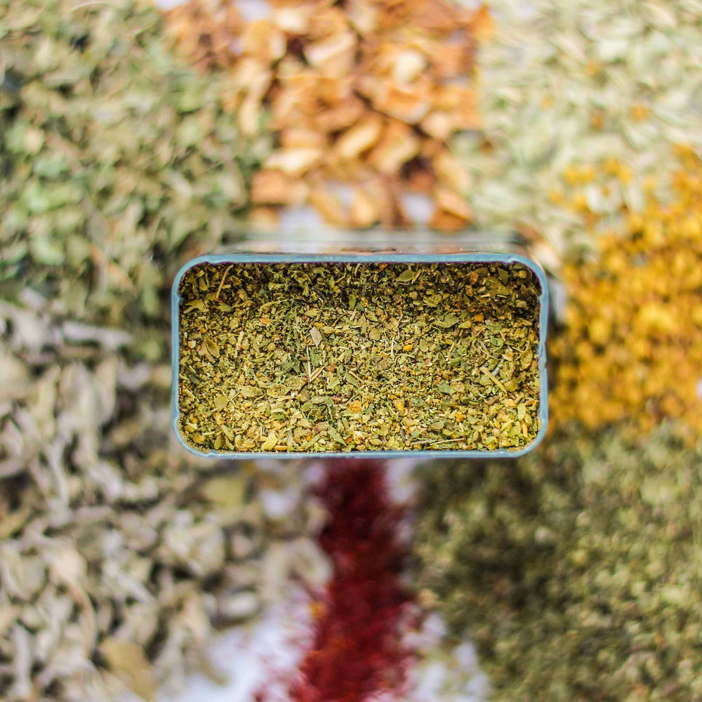 Top-down view of Kozani Spice, with fennel, lemon peel, bee pollen, and more.