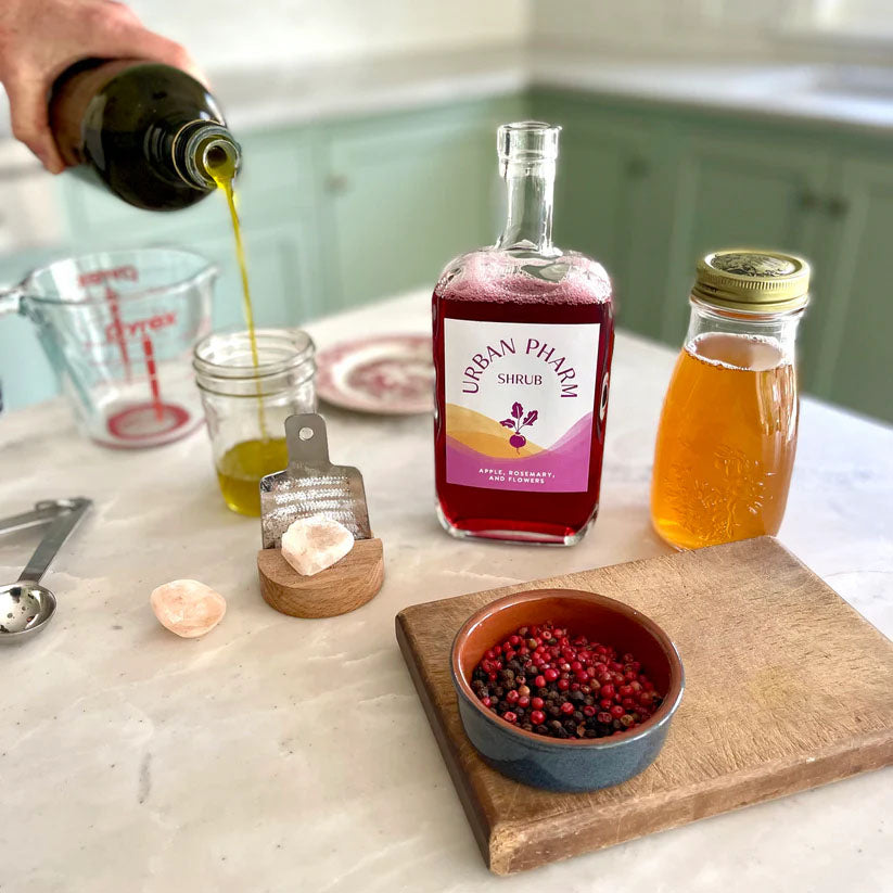 Apple, Rosemary, & Flowers Shrub being poured