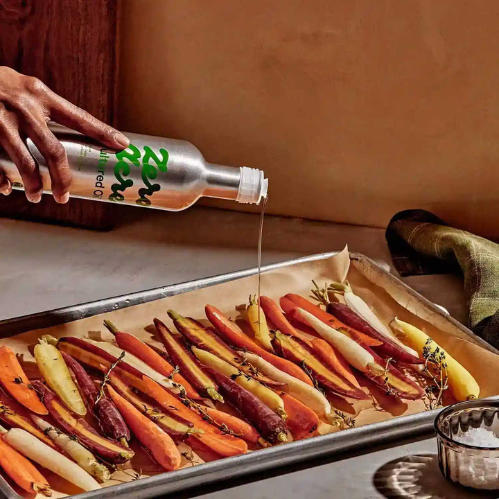 Image of Zero Acre Oil being drizzled on oven-roasted carrots